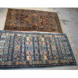 A blue ground Tunisian rug, 141cm x 70cm and an Eastern floral design carpet, 130 x 68cm (2).