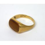 A 9ct gold gentlemen's signet ring set with amber-coloured stone, size O, approx 3.