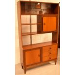 A G-Plan style teak unit/dresser, raised on tapering supports, width 107cm.