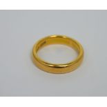 A 22ct yellow gold band, size H, approx 4.7g.