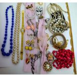 A quantity of costume jewellery to include brooches, bangles, necklaces, watches etc.