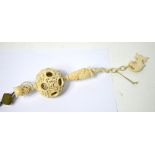 An early 20th century Chinese export ivory concentric hanging puzzle ball,