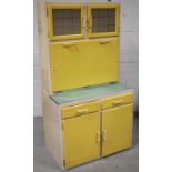 A mid-20th century yellow painted kitchen unit, width 84cm.