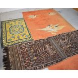 A Chinese orange ground wall hanging decorated with cranes, 239 x 120cm,