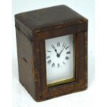 A French brass carriage clock, the dial set with Roman numerals, height 11cm,