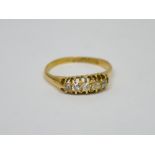 An 18ct yellow gold ring set with a row of five diamonds, size R, approx 2.8g.