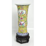 A Chinese famille rose Gu form vase with an indistinct mark to the base,