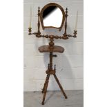 An unusual freestanding walnut dressing table mirror with horseshoe-shaped plate flanked by sconces,