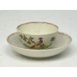 Attributed to John Pennington, a Liverpool tea bowl and saucer, exotic bird pattern, c.1780 (2).