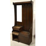 An Ercol style oak hallstand/combination telephone table, width 93cm.