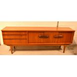 A G-Plan style teak sideboard, raised on tapering supports, width 213cm.