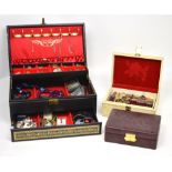 A quantity of costume jewellery contained within three jewellery boxes, to include brooches,