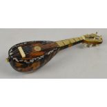 A tortoiseshell, ivory and mother of pearl inlaid miniature bowl back mandolin, length 14cm.