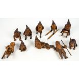 A group of ten 20th century Black Forest style figures of dwarves in various poses to include one