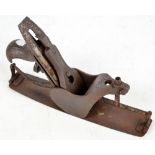 An early iron woodworking plane with open body and side ratchet system, stamped "No 11"',