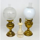 A duplex brass oil lamp, a brass oil lamp converted to electricity and a table lamp (3).