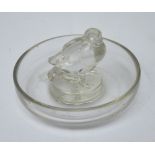 Lalique; a pre-1945 clear glass pin dish centred with a bird and with etched mark to base "R.