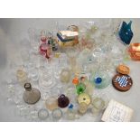 A quantity of glassware to include paperweights, drinking glasses, decanters etc.