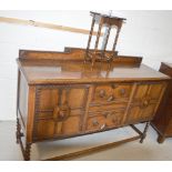 An early 20th century oak sideboard,