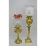 A large duplex brass oil lamp with column style support,