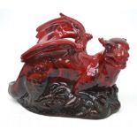 A Royal Doulton veined flambé recumbent dragon, signed and dated 1996 to the base,