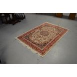 A beige ground Keshan rug, 190 x 140cm.