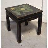 An Oriental black gilt-heightened side table, the top painted with water lilies and hummingbirds,