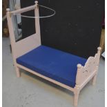 A lilac painted large dolls' bed with metal hoop for drapes, 101 x 51cm.