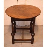 A mid-Victorian oak table on turned legs with conjoining stretcher to block supports, width 76cm.