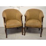 A pair of tub chairs, upholstered in Zoffany fabric on front cabriole legs.