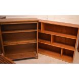 A mid-20th century bookcase with two shelves, reeded sides and block supports,