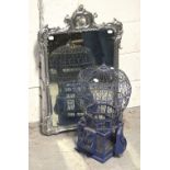 An early 20th century rectangular wall mirror with silver painted carved frame,