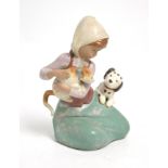 A Lladró salt glazed figure group depicting a kneeling young girl with a cat and dog, height 19cm.