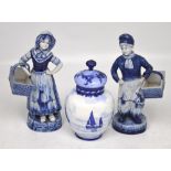 A pair of early 20th century blue and white figures in Dutch costume and a Royal Crown Derby blue