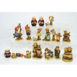 Sixteen various Hummel and Goebel figures, to include a cruet set modelled as a pair of monks,