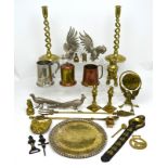 A quantity of metalware to include a pair of brass candlesticks, white metal animals etc.