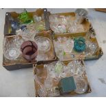 A large quantity of glassware to include coloured glass paperweights, Champagne flutes, vases,