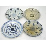 Four various Chinese porcelain blue and white cargo or provincial bowls/dishes,