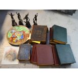 A collectors' lot comprising four spelter figures, a H J Wood Burslem hand painted wall plaque,