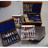 A quantity of silver plated flatware, part-contained within three canteens.