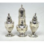 A pair of Edward VII hallmarked silver salt and pepper shakers,