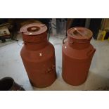 Two large red milk churns, one with John West Ironmonger of Leek plaque (2).