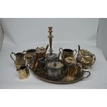A quantity of silver plated items to include a twin-handled tray and a vacant oak canteen for