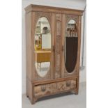 A carved walnut twin-door wardrobe,