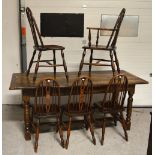 An oak refectory style table, cleated plank top above turned legs,