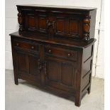 A 20th century oak priory style court cupboard,