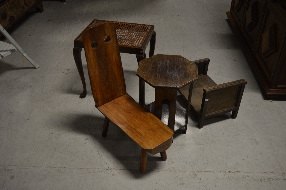 A South American hardwood naturalistic stool, a cane seated footstool on cabriole legs,