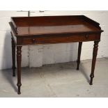 A Victorian mahogany side table with large slim single drawer raised on turned legs, width 106cm.