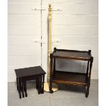 An oak two-tier tea trolley in the priory style,