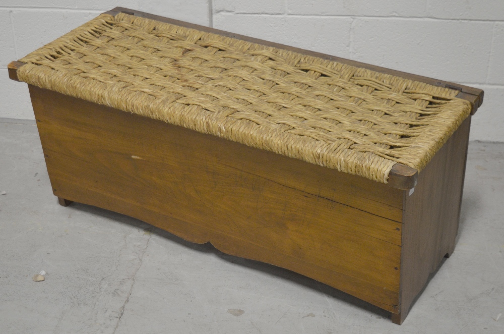 A 20th century hardwood blanket chest with willow or rush hinged top, width 105cm.